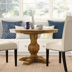 an image of a dining room table and chairs on the webpage for furniture stores