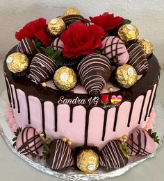 a chocolate covered cake with roses on top