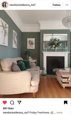 a living room filled with furniture and a fire place next to a wall mounted mirror