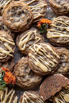 cookies with icing and flowers on a cooling rack