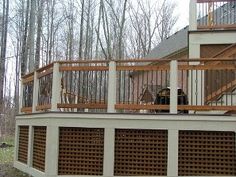 a house with a wooden deck and railing