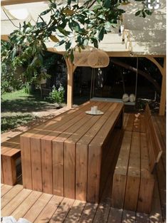 a wooden bench sitting on top of a wooden deck