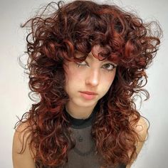 30 Best Curly Wolf Cut Ideas | HairAide Red Curly Shag Hair, Curly Choppy Layers, Alternative Hair Curly, Best Hair Color For Curly Hair, Alternative Curly Hair, Curly Layered Hair, Havana Twist Crochet, Curly Wolf Cut, Cuts For Curly Hair