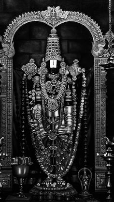 an idol is displayed in black and white