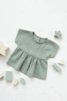 Girls linen Blouse in Dusty Mint color. Ruffled top for girls and toddlers. Casual summer children top for beach, birthday. * Please note that actual colors may vary due to your computer resolution and monitor color restrictions. To have a perfect color match you can always order a linen samples. * Please, write up to 10 color fabric samples if you would like to get them with your purchase from my shop. Samples will be added for free . Details: - 100% Lithuanian linen; - very soft, pure linen fa Playful Ruffled Blouse For Summer, Playful Summer Blouse With Ruffles, Cute Summer Blouse With Flutter Sleeves, Cute Summer Tops With Flutter Sleeves, Cute Flutter Sleeve Blouse For Summer, Cute Flutter Sleeve Tops For Summer, Playful Ruffled Tops For Vacation, Playful Summer Blouse For Vacation, Playful Ruffled Tops For Beach