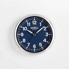 an analog clock with the word shinola on it's face and numbers displayed