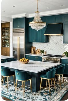 a kitchen with blue cabinets, gold accents and chandelier hanging from the ceiling