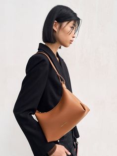 This product is made with at least 20% sustainable materials by weight. CHARLES & KEITH uses recycled, degradable, organic, and water-based materials in our eco-conscious collection. This item is part of our Online Exclusive selection, which consists of unique colourways and designs that are only available for purchase at CHARLESKEITH.COM. If you are seeking a non-black everyday bag that exudes elegance and versatility, consider the Aurelie trapeze hobo bag in a tan brown shade. It boasts a sleek trapeze silhouette balanced by a soft and semi-slouchy construction, creating a relaxed and effortless aesthetic. The thick and adjustable shoulder strap lets you style the Aurelie in multiple ways, prioritising comfort by distributing weight evenly and reducing stress on your shoulders. Effortless Aesthetic, Trapeze Silhouette, Brown Shade, Size Chart For Kids, Charts For Kids, Brown Shades, Charles Keith, Everyday Bag, Printables Kids