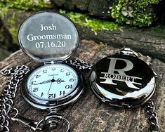 a pocket watch sitting on top of a rock