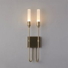 Illuminate your space with the Candela Contemporary Wall Sconce. With its soft light, this sconce creates a warm and inviting atmosphere, perfect for any room in your home. Add a touch of contemporary style and ambiance to your interior design with this sleek and modern lighting fixture. SPECIFICATIONS: Light Source: LED (Included) Style: Contemporary Installation Type: Wall Mounted Item Type: Wall Lamps Warranty: 3years Number of light sources: 1 Dimmable: No Dimensions: 1 Head W2.7" x H22" / 2 Heads W5.5" x H22" Material: Iron, Acrylic Shade Direction: Up & Down Power Source: AC Shade Type: Acrylic Model Number: 0301 Usage: Daily Lighting Base Type: Wedge Voltage: 90-260V Color: Gold Staircase Restaurant, Villa Staircase, Lamp Luxury, Entryway Chandelier, Modern Living Room Wall, Wall Lamps Living Room, Contemporary Wall Sconces, Pendant Lighting Dining Room, Dining Room Light Fixtures