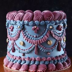 a blue and purple cake on a table