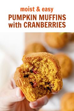 a person holding up a muffin with cranberries in the background and text overlay that reads, moist & easy pumpkin muffins with cranberries