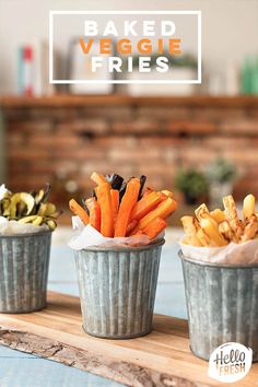 three tins filled with different types of food