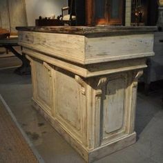 an old church pulpit with wooden doors and carvings on the front, in a museum