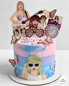 a birthday cake decorated with photos and pictures on it's side, including a woman wearing sunglasses