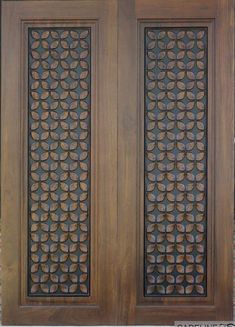 an ornate wooden door with decorative carvings on the front and side panels, made out of wood