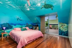 a bedroom with an underwater theme painted on the walls and ceiling, along with a bed