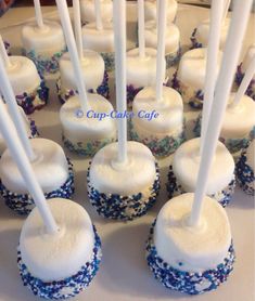 cupcakes with white frosting and blue sprinkles