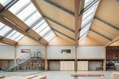 the inside of a building with benches and stairs