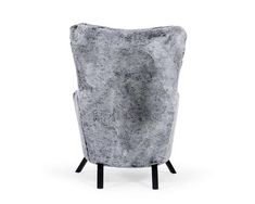 a grey chair sitting on top of a white floor