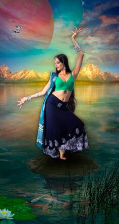 a woman in a green top and blue skirt is dancing on the water with her arms outstretched