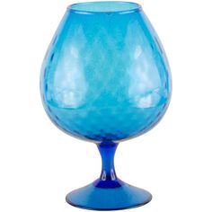 a blue glass sitting on top of a table