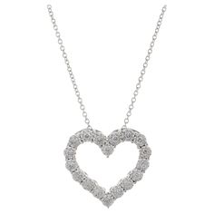 Express your love with the 14KT White Gold Open Heart Diamond Pendant with Chain. This charming pendant features a beautiful open heart design, adorned with 0.25ct-tw G-H color, SI1-SI2 clarity round-cut diamonds. Suspended from a delicate white gold chain, the necklace combines elegance with a touch of romance. The sparkling diamonds enhance the timeless appeal of the open heart motif, making this pendant a symbol of enduring love and a stylish accessory for any occasion. Length 17 inches. Weig Diamond Heart Pendant Necklace, White Gold Chain, Gold Hamsa, Hamsa Pendant, Heart Motif, Heart Necklace Diamond, White Gold Chains, Heart Diamond, Pendant With Chain