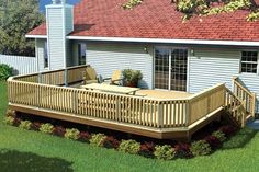 a wooden deck in front of a white house