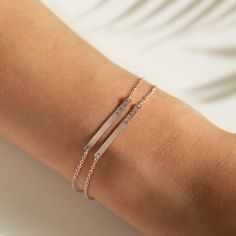 Sleek and dainty, this engravable initial bracelet features a thin bar on a Rolo chain. Perfect for layering with other bracelets or worn alone. Gold Vermeil Rolo chain, width 1.1mm Hypoallergenic, lead and nickel free Plate measurement: Width 1in (2.7cm) x Height 0.2cm(2mm) Lengths: 6.25in (16cm) and 6.5in (16.5cm) with 1in (2.5cm) extension. Laser Engraving Handcrafted in NYC #B050 Initial Bracelet Gold, Id Bracelets, Initial Bracelet, Engraved Jewelry, Bridal Gold Jewellery, Silver Bars, Rolo Chain, Fashion Accessories Jewelry, Bar Necklace