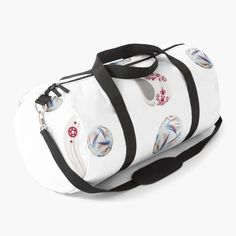 a white duffel bag sitting on top of a white floor