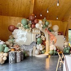 an animal themed party with balloons and decorations