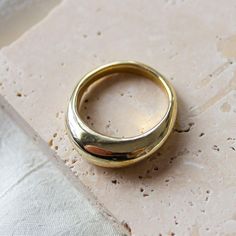 The Arch Ring is a classic rounded dome ring band. Stack it for a modern look and try pairing it with the best-selling Atrium or Wisdom Ring. Details: This modern, organic ring was first created by hand in wax Available in recycled brass, 14k gold plated brass or sterling silver. Sizes 5-9 kept in stock, inquire for custom sizing Silver is made to order, please allow 1-2 weeks to ship if not in stock. Read jewelry care instructions below Shop the Solid 14k Gold Arch Ring. Handmade in Downtown Lo Gold Dome Ring, Ring Inspiration, Organic Rings, Modern Organic, Dome Ring, Organic Ring, Ring Stack, Jewelry Care Instructions, Casting Jewelry