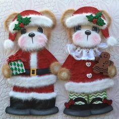 two teddy bears dressed up in christmas outfits