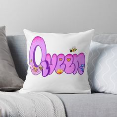 the word queen with bees and flowers on it throw pillow