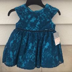 This Dress Is So Pretty For Your Little One. Teal Lace Detailing With A Little Bit Of Sparkle. Velvet Bow, Cap Sleeves. My Lo Never Got A Chance To Wear It. Nwt. Offers Welcome! Teal Dress, Velvet Bow, Kids' Dresses, So Pretty, Lace Detail, Cap Sleeves, Colorful Dresses, Sparkle, Velvet