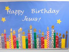 a bulletin board with candles and stars on it that says, happy birthday jesus?