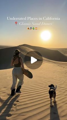 a woman and her dog walking in the sand dunes at sunset with caption that reads, underrated places in california clam's salt dunes