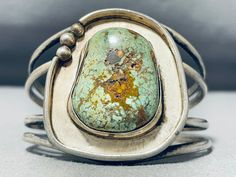 MAKE US AN OFFER BY CLICKING THE "MESSAGE SELLER" Button- Up for sale is this remarkable vintage Navajo silver bracelet.  The super-sized Royston turquoise stone sets inside the silver platform as it rises up around it at the heart of this unique split double/double rail bracelet! The center stone measures around 1-1/4" x 1". The width of the bracelet measures around 1-13/16". Sterling silver. The inside end to end measures around 6" with an additional 7/8" gap. Sturdy 50 grams. Cir Mid Century Metal Jewelry Making, Silver Platforms, Navajo Bracelet, Royston Turquoise, Vintage Navajo, Sterling Silver Bracelet, Native American Jewelry, Turquoise Sterling Silver, Turquoise Stone