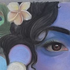 a woman's face with flowers on her head and eyes painted in pastel