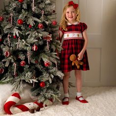 Make Christmas extra special with the ultimate festive dress! Red and navy tartan dress with puff sleeves, sweet collar, frill trims and a hand-smocked gingerbread on the bodice. Fully lined with button closure at the back. Shell: 80% polyester 17% viscose 3% elastane Lining: 100% cotton Machine wash with similar colors. Medium steam iron. Red Tartan Dress, Smocked Christmas Dresses, Festive Dress, Dress With Puff Sleeves, Hand Smock, Red Embroidery, Bridal Party Dresses, Tartan Dress, School Dresses