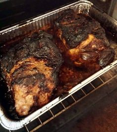 two pieces of meat sitting in an oven