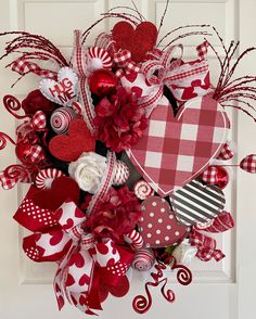 a valentine's day wreath with red and white hearts