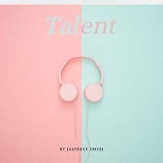 a pair of headphones sitting on top of a pink and blue book with the word talent