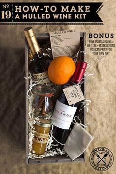 an open box containing wine bottles and other condiments with the words how to make a mulled wine kit