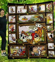 a woman standing next to a large blanket with cartoon pictures on the front and sides