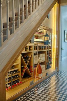 an instagram photo of a wine cellar under the stairs