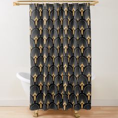 a black and gold shower curtain with an art deco design on it's side