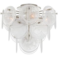 a chandelier that has five lights on each of it's glass shades