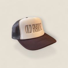 Stand out from the crowd with our Old Fashioned Trucker Hat in a classic khaki and brown color combination. Perfect for the playful and quirky drinker who always appreciates a good throwback cocktail. Cheers to making a statement with style! Brown Trucker Hat With Flat Brim, Vintage Hats For Outdoor Fall Use, Vintage Outdoor Hat For Fall, Vintage Fall Hat For Outdoor, Vintage Distressed Brown Hat With Curved Brim, Vintage Distressed Brown Brimmed Hat, Distressed Brown Brimmed Vintage Hat, Vintage Adjustable Distressed Brown Hat, Brown Casual Trucker Hat With Curved Brim