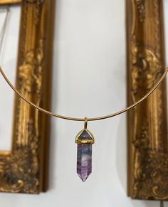 "Fluorite pendant hung on a gold-plated or silver-plated choker measuring 38 cm. The pendant measures 0.7 cm x 3.3 cm. Comes wrapped in tissue as the necklace is too big for a box. \"Fluorite is a stone of mental order and clarity. It is used to enhance mental clarity and reduce instability and disorder. This brings a wiser, more balanced view of life and improves decision making,. These traits enable one to manifest ideas and bring plans to fruition.\"" Wire Wrapped Choker Necklace As Gift, Wire Wrapped Choker Necklace For Gift, Wire Wrapped Choker Necklace Gift, Spiritual Gemstone Choker As A Gift, Gold Spiritual Crystal Choker Necklace, Adjustable Fluorite Bohemian Jewelry, Bohemian Fluorite Necklace For Healing, Fluorite Pendant Necklace For Healing, Healing Fluorite Pendant Necklace